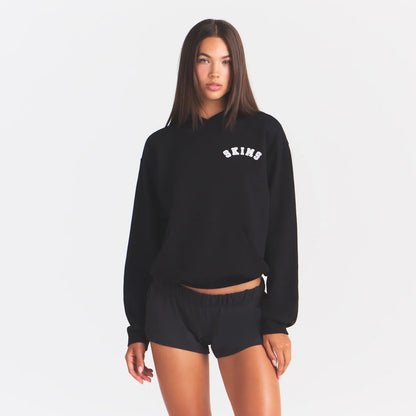 COTTON FLEECE HOODIE | ONYX SNOW ARCHED SKIMS LOGO